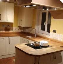 MJF Installations kitchen fitting showing wood worktops and island